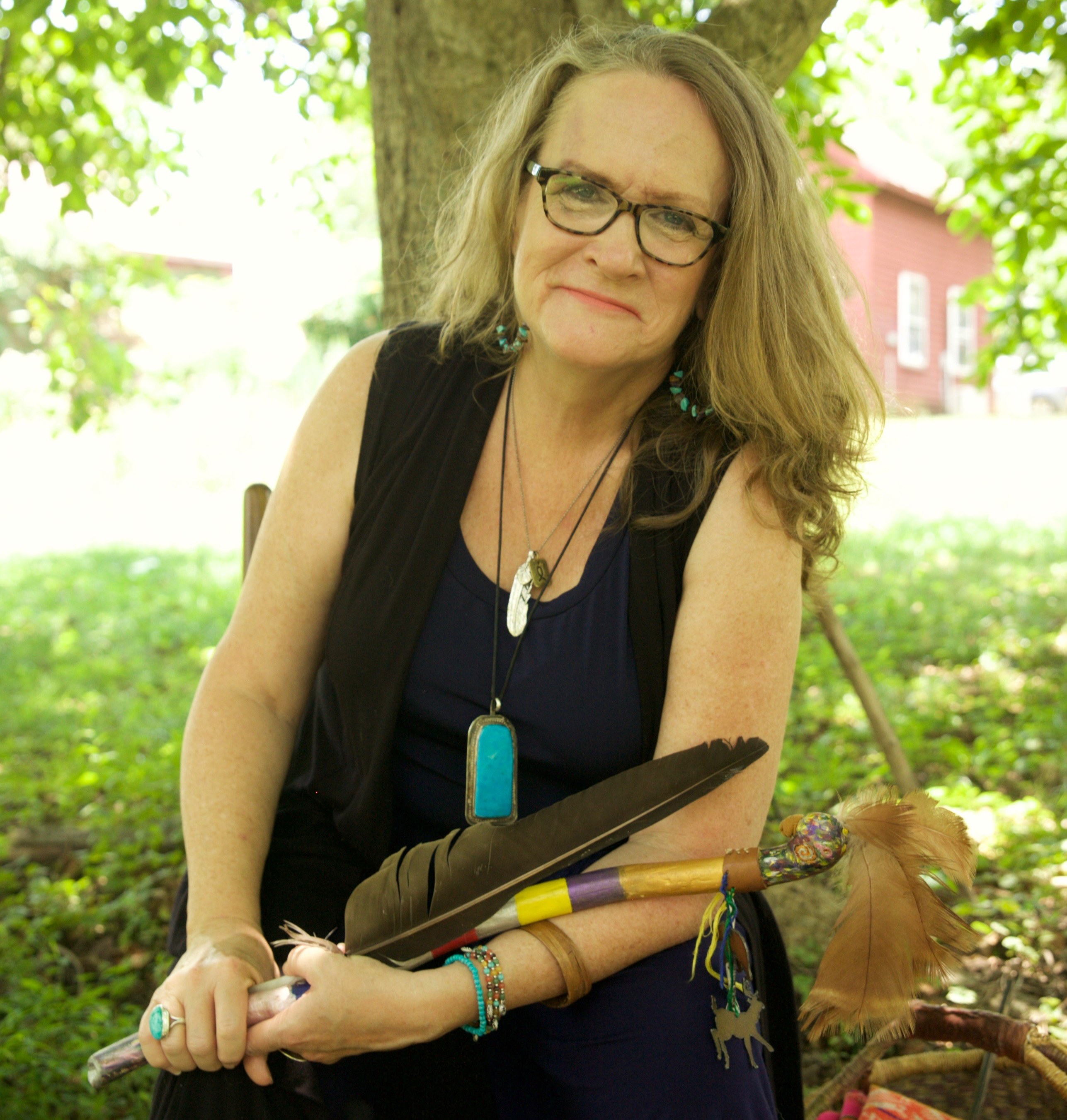 rachel with talking stick and feather